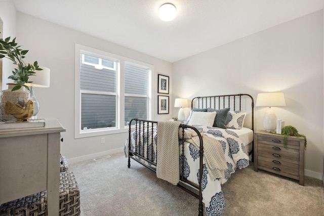 bedroom featuring light colored carpet