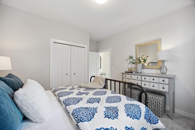 carpeted bedroom with a closet