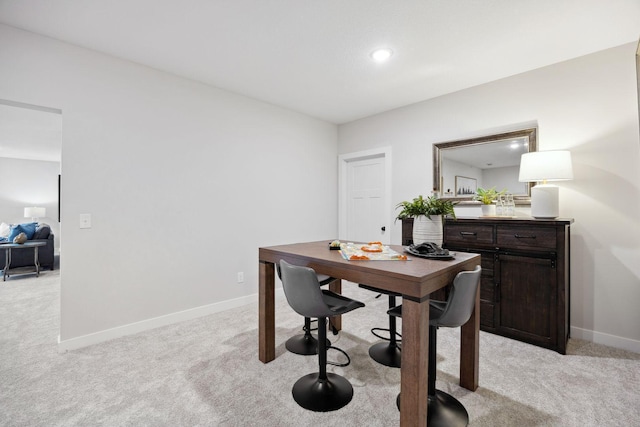 view of carpeted dining area