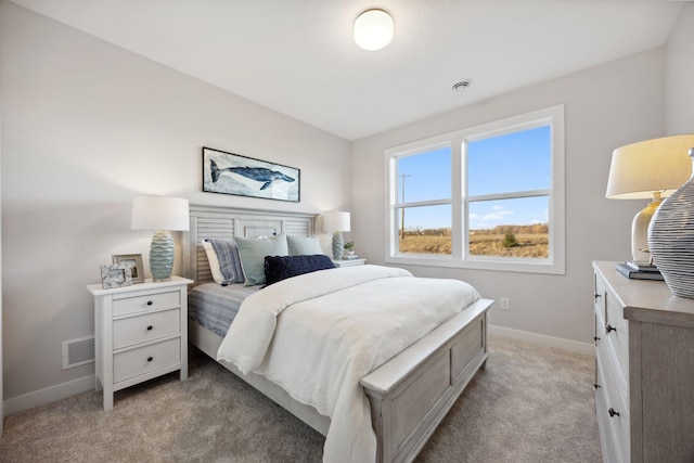 bedroom with light colored carpet