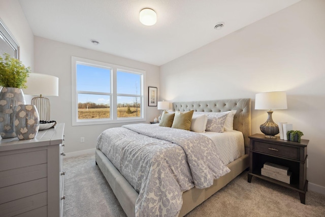 carpeted bedroom featuring multiple windows