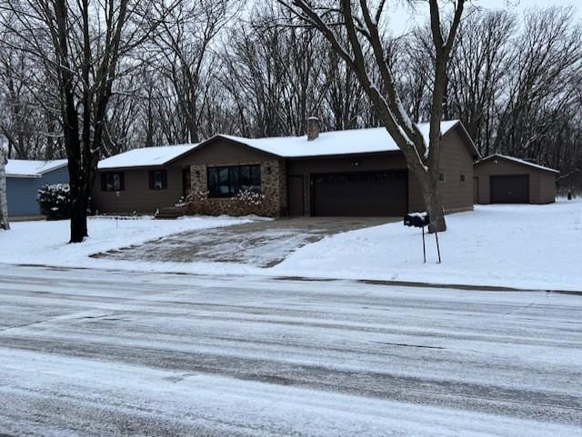 single story home with a garage