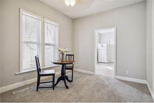 view of carpeted dining area