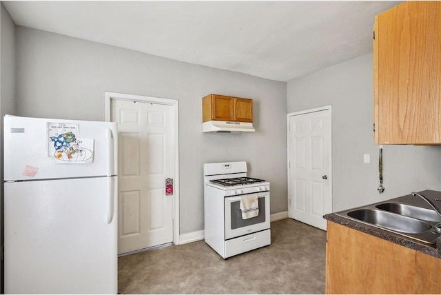 kitchen featuring carpet flooring, sink, and white appliances