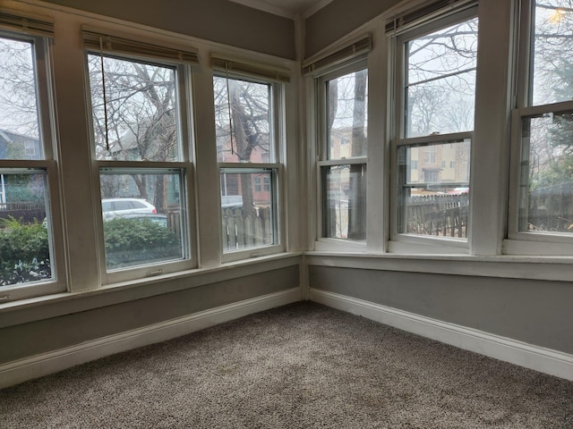 unfurnished sunroom with a wealth of natural light