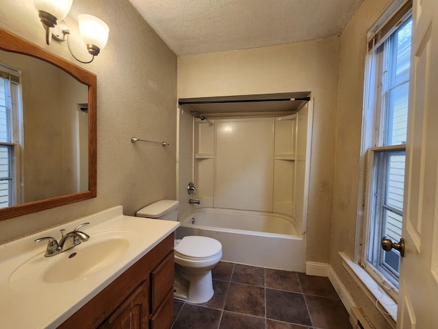 full bathroom featuring tile patterned floors, vanity, a textured ceiling, bathing tub / shower combination, and toilet