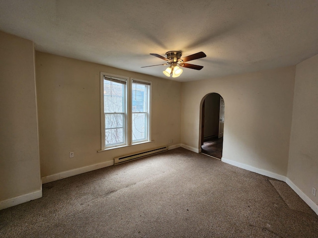 carpeted empty room featuring a baseboard radiator and ceiling fan