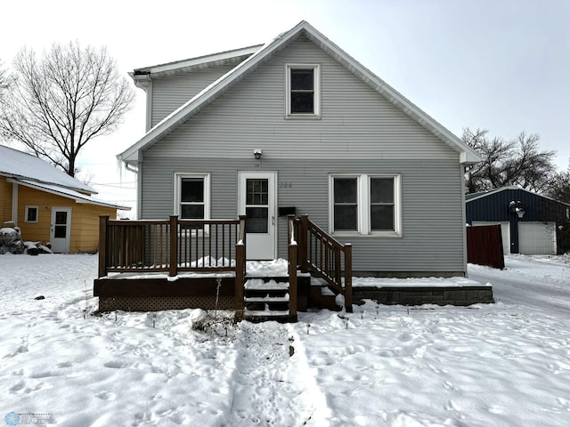 view of front of property featuring a garage and an outdoor structure