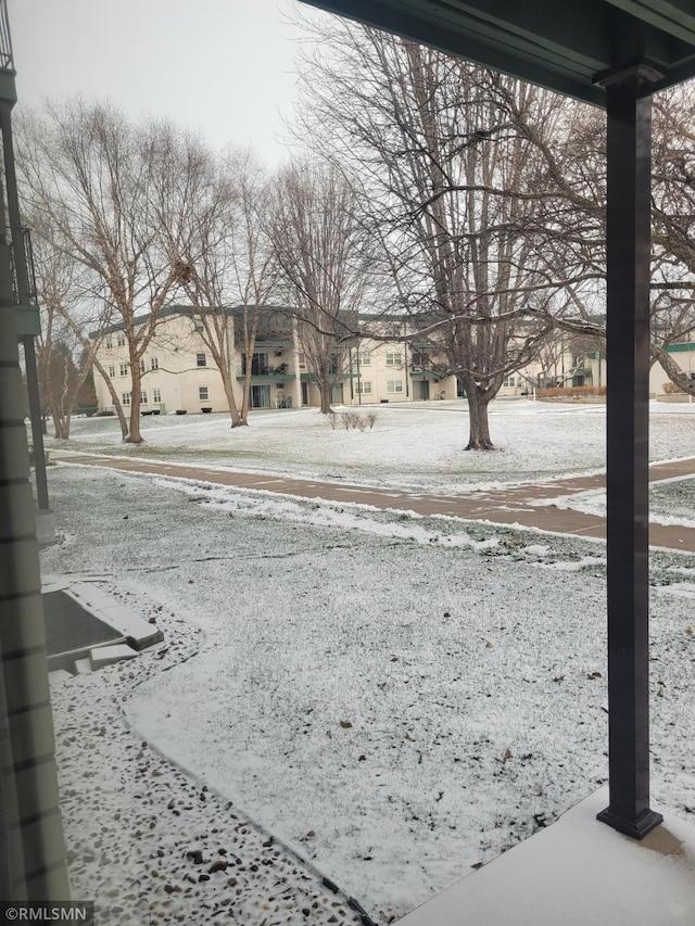 view of yard layered in snow