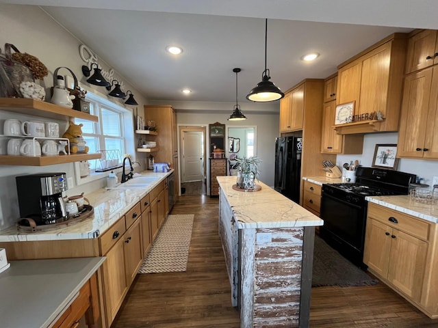 kitchen featuring dark hardwood / wood-style flooring, a kitchen island, black appliances, and sink