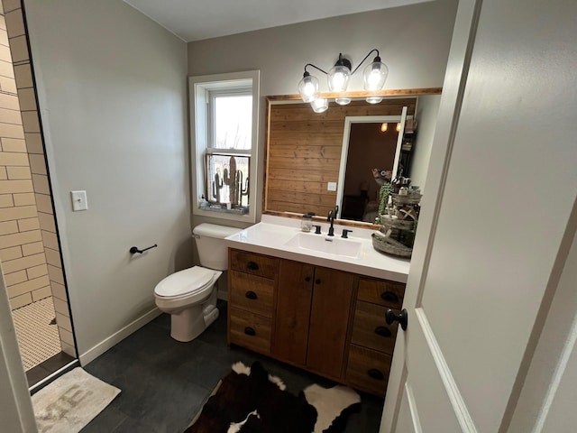 bathroom featuring vanity, toilet, and walk in shower