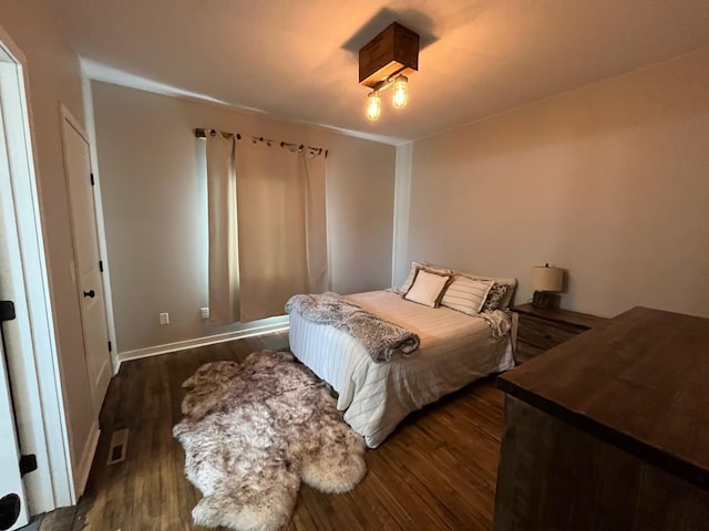 bedroom featuring dark hardwood / wood-style flooring