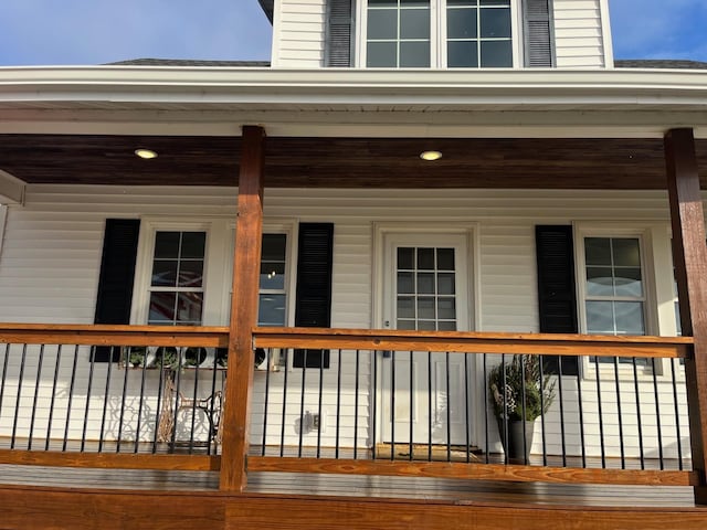 wooden deck featuring covered porch