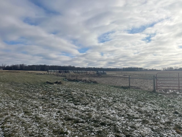 view of yard with a rural view