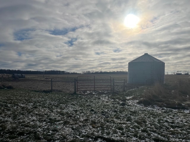 view of yard with a rural view