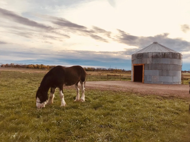 view of horse barn featuring a rural view