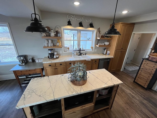 kitchen featuring dishwasher, sink, a center island, dark wood-type flooring, and decorative light fixtures