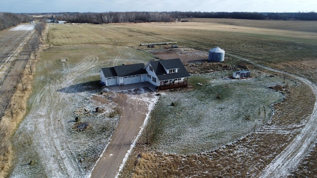 birds eye view of property with a rural view