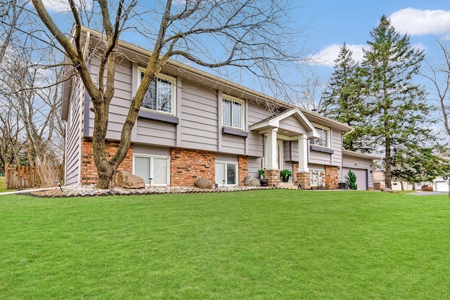 raised ranch featuring a front yard