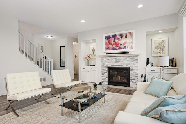 living room with a fireplace and light hardwood / wood-style floors