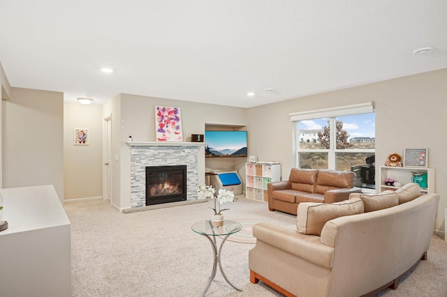 living room featuring a stone fireplace and light colored carpet