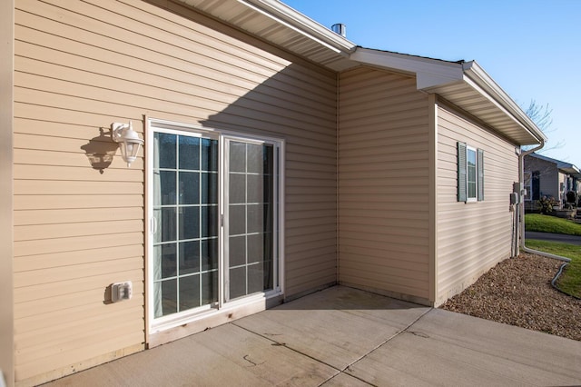 view of side of home featuring a patio area