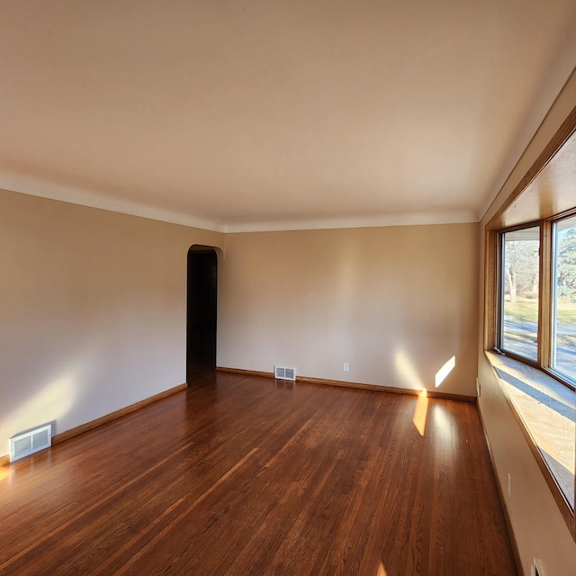 unfurnished room with dark hardwood / wood-style floors