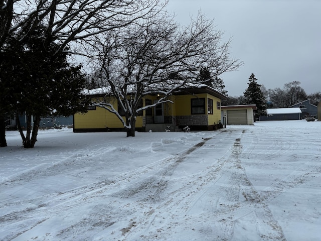 view of front of home with an outbuilding and a garage