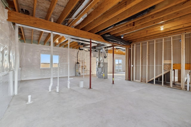 basement with heating unit and water heater