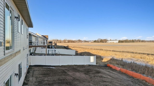 view of yard with a rural view