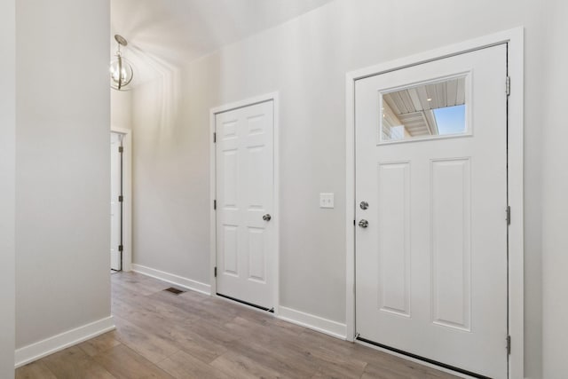 foyer entrance with light hardwood / wood-style flooring