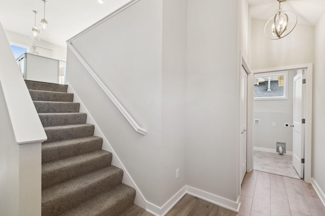 staircase featuring hardwood / wood-style flooring