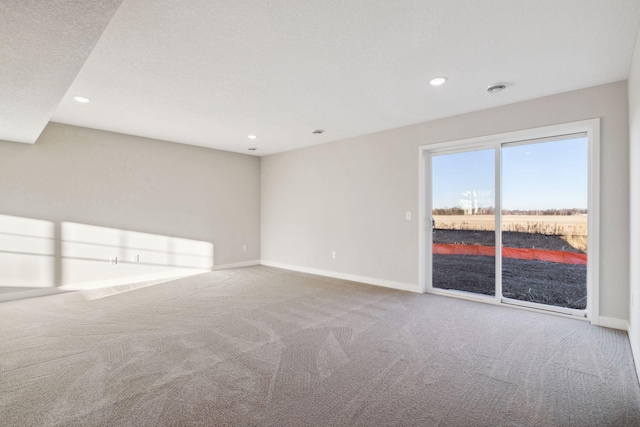 unfurnished room featuring carpet