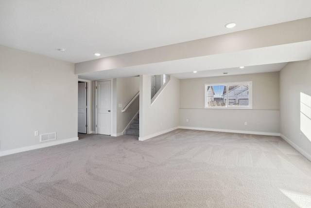 basement with light colored carpet