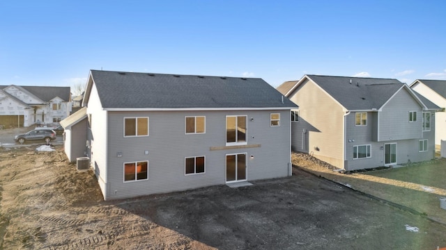 back of property featuring central AC unit