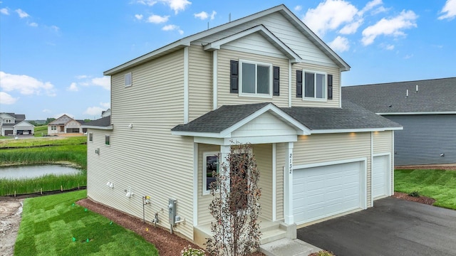 view of front of house featuring a front yard and a garage