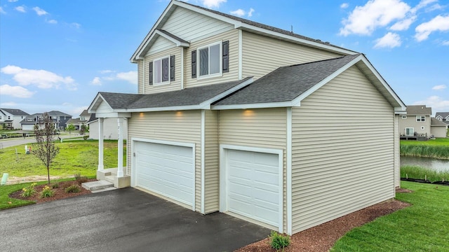 garage featuring a lawn