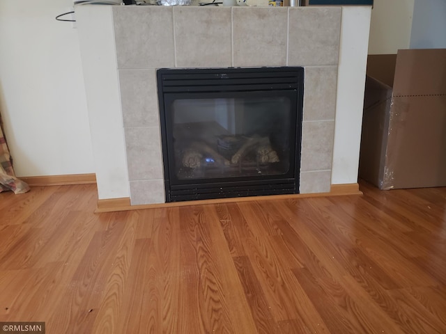 interior details with a fireplace and hardwood / wood-style flooring