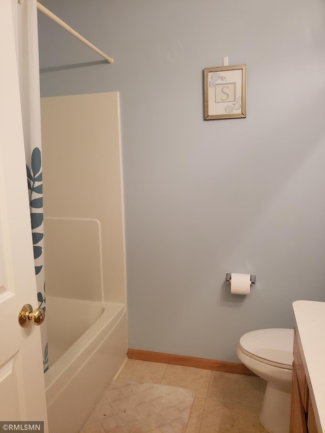 full bathroom featuring tile patterned floors, toilet, bathing tub / shower combination, and vanity