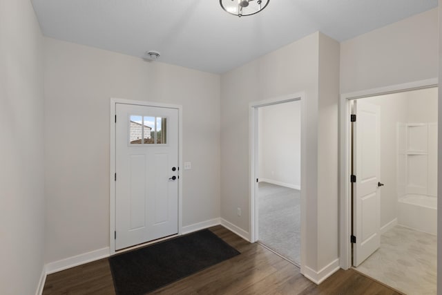 entryway with hardwood / wood-style floors