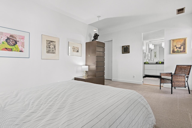 carpeted bedroom featuring visible vents and baseboards