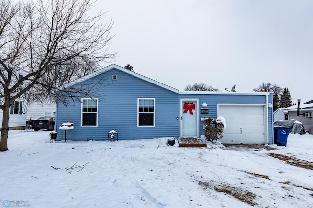 ranch-style home featuring a garage