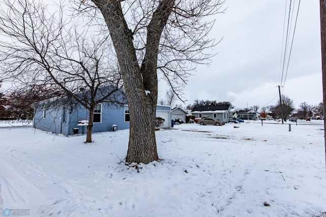 view of yard layered in snow