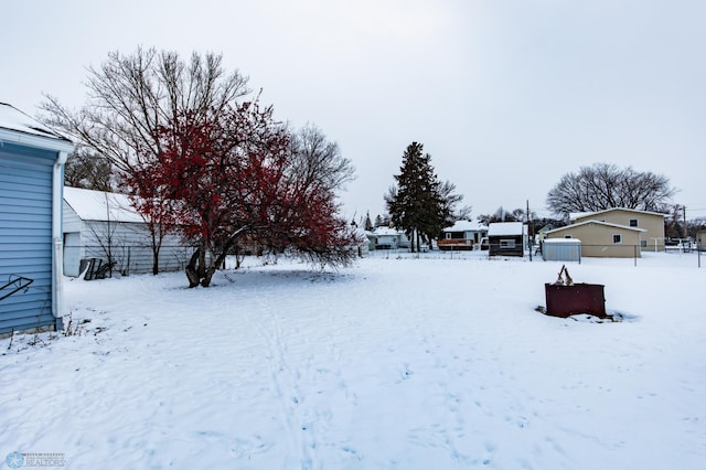 view of yard layered in snow