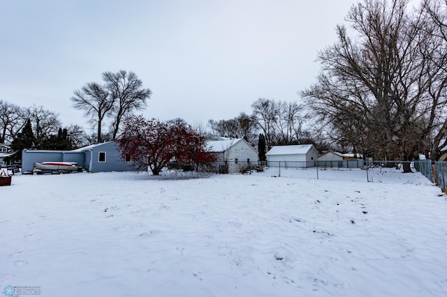 view of yard layered in snow