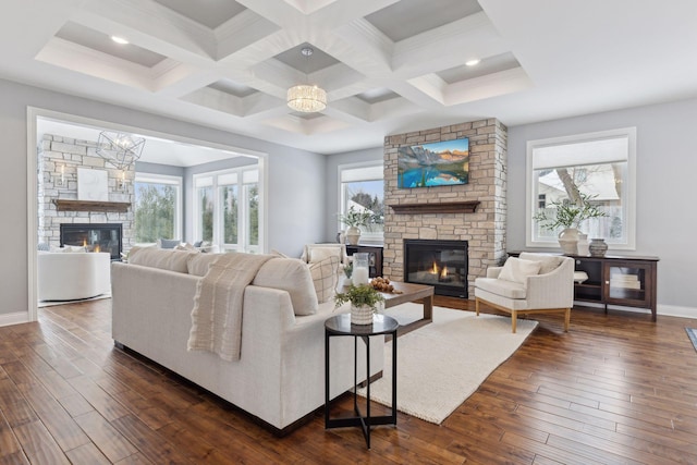 living room featuring dark wood-style floors, a fireplace, baseboards, and beamed ceiling