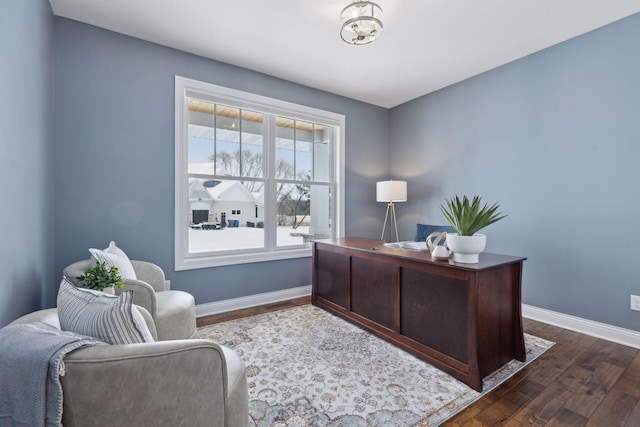 office area with baseboards and dark wood-style flooring