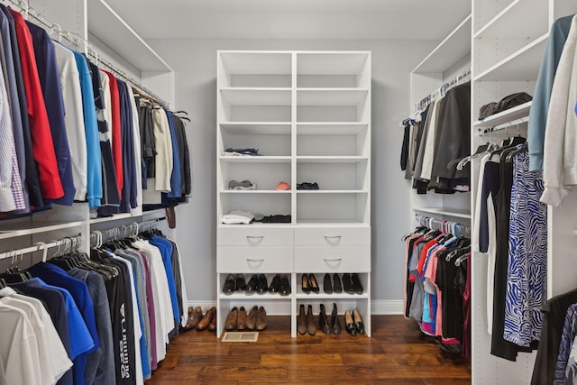 walk in closet featuring dark wood-type flooring