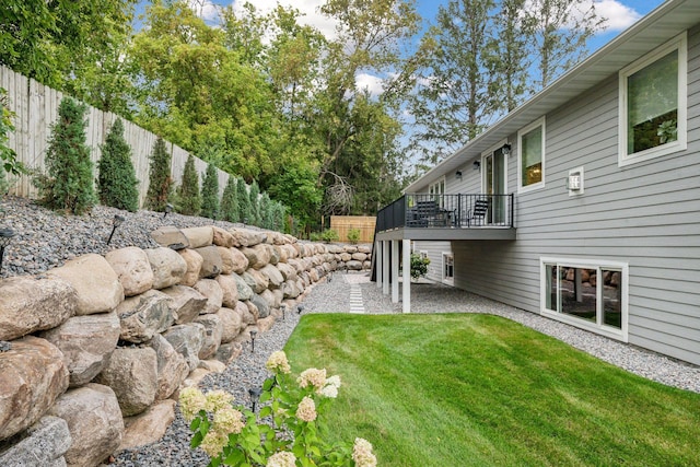 view of yard with fence and a wooden deck