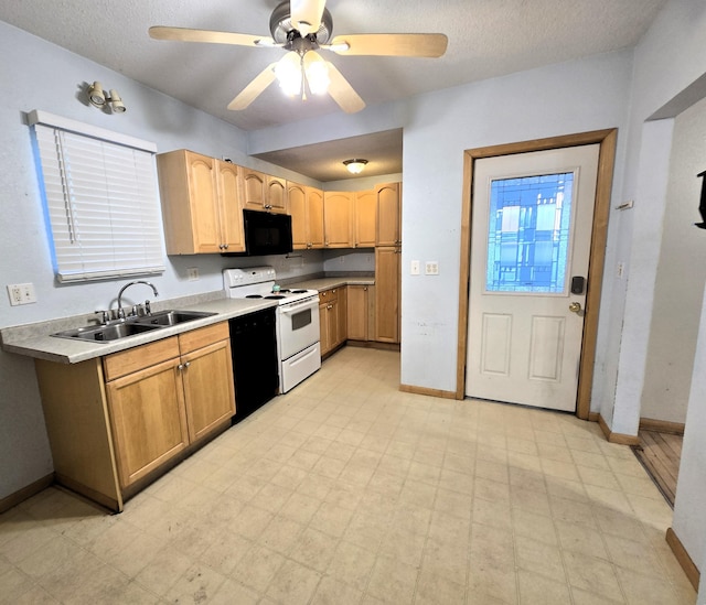 kitchen featuring a textured ceiling, ceiling fan, black appliances, and sink